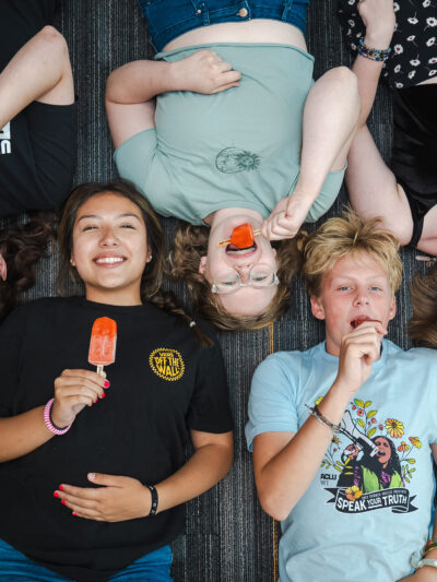 Photograph of ACLU of Wisconsin youth program attendees enjoying Pete's Pops popsicles