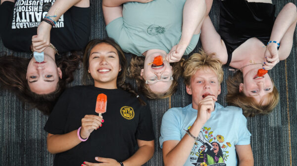 Photograph of ACLU of Wisconsin youth program attendees enjoying Pete's Pops popsicles