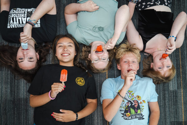 Photograph of ACLU of Wisconsin youth program attendees enjoying Pete's Pops popsicles