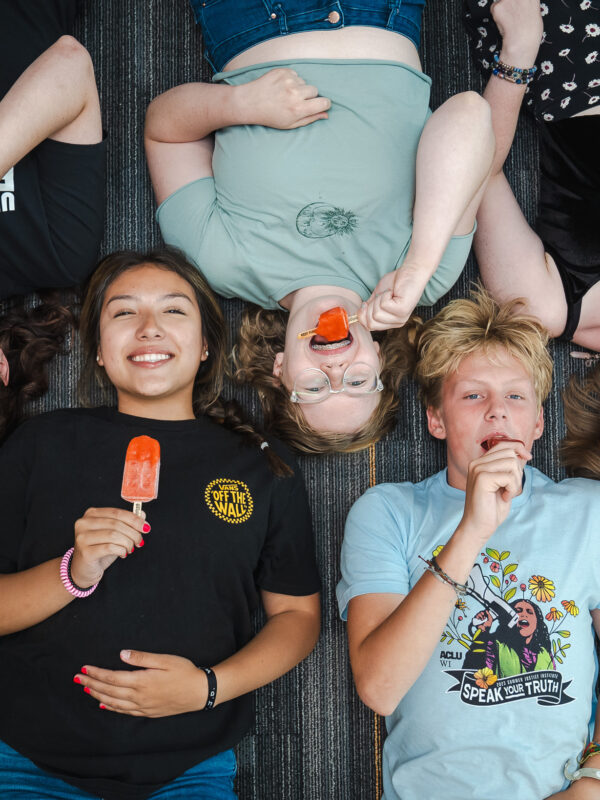 Photograph of ACLU of Wisconsin youth program attendees enjoying Pete's Pops popsicles