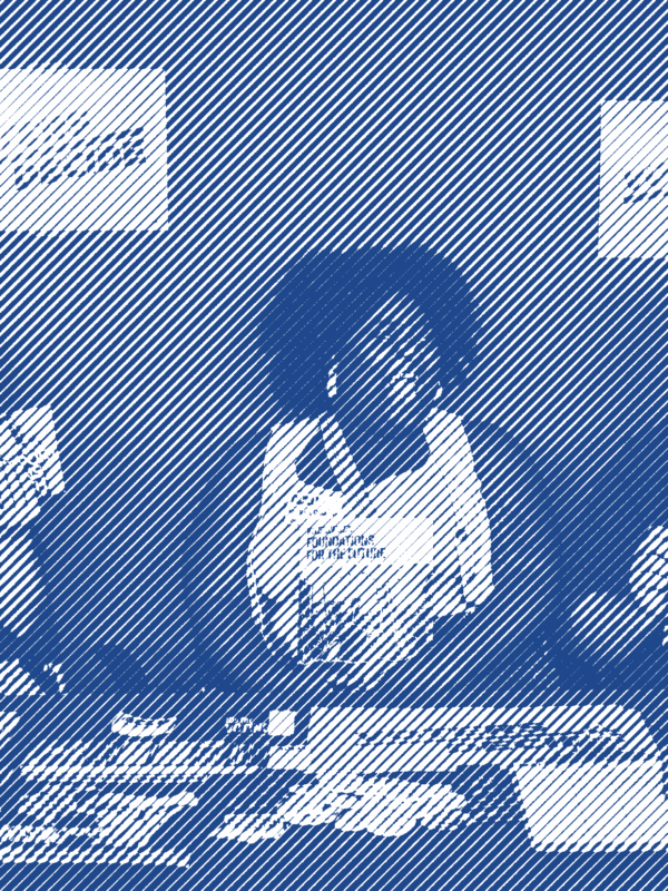ACLU of Wisconsin staff sitting at a table laden with information and resources