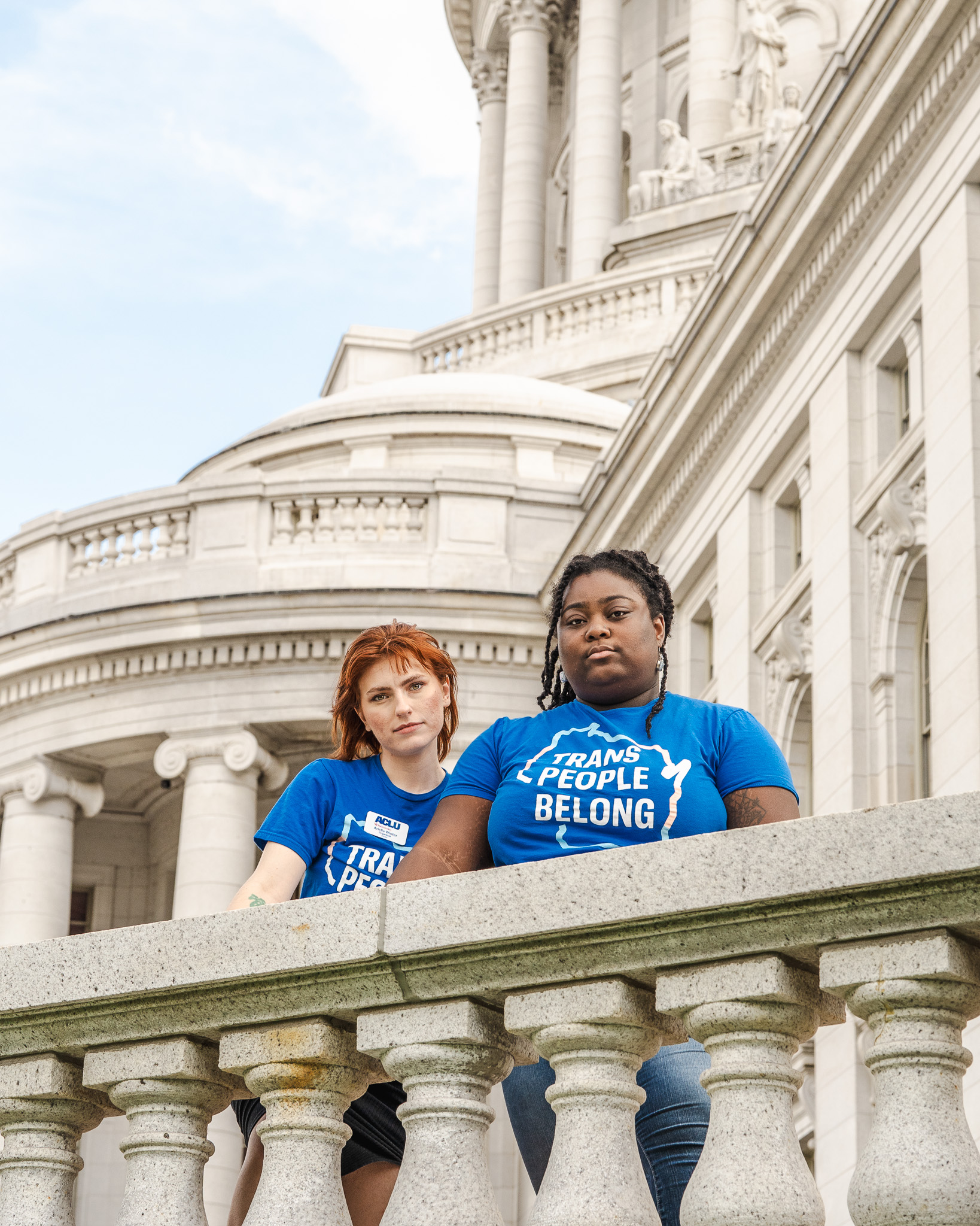 Photo of ACLU of Wisconsin organizers at the Wisconsin Capitol wearing Trans People Belong