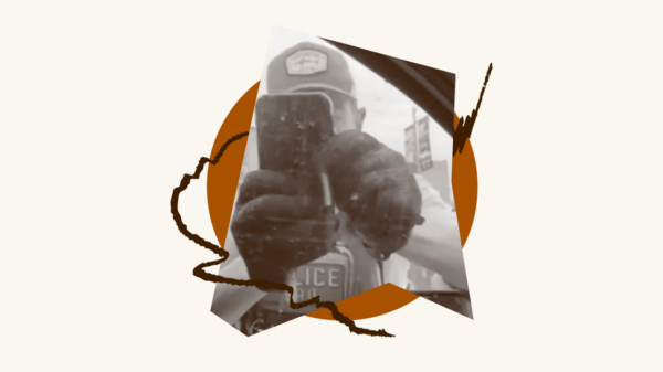 ICE agent filming someone in their car using his phone