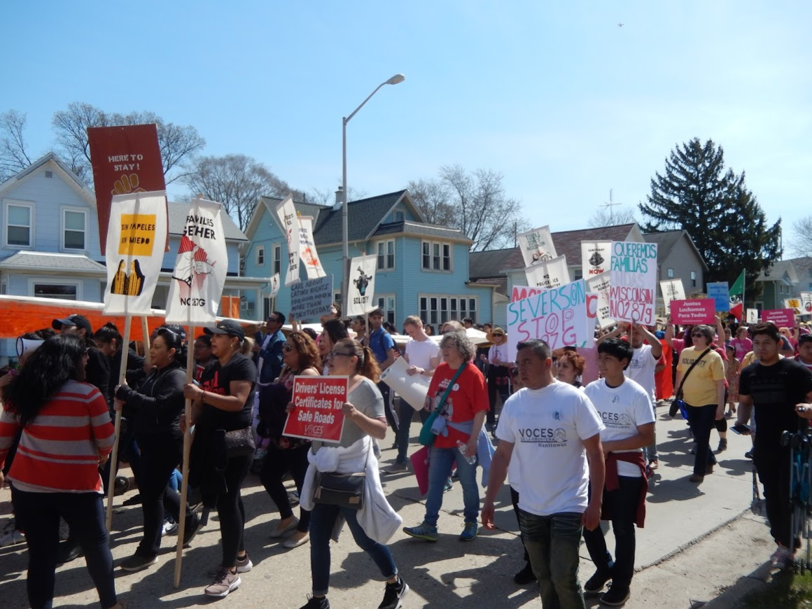 Protestors march through streets of Waukesha May 1 2018.png