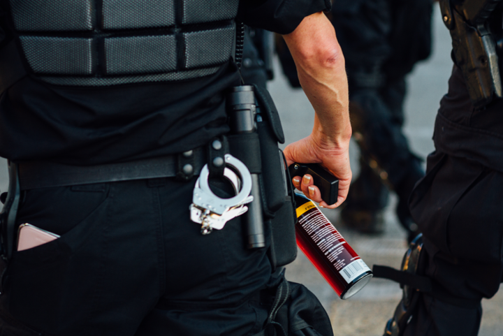 Photo of a canister of pepper spray on a police officer's belt.