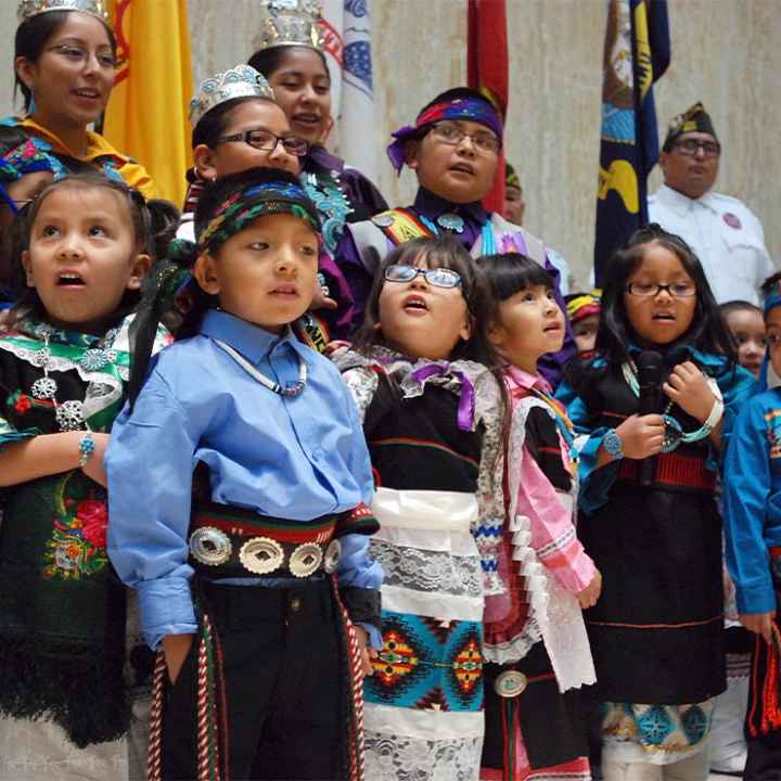 Children from the Zuni Pueblo lead the U.S. pledge of allegiance in the Zuni language in the New Mexico state Capitol in Santa Fe, N.M.