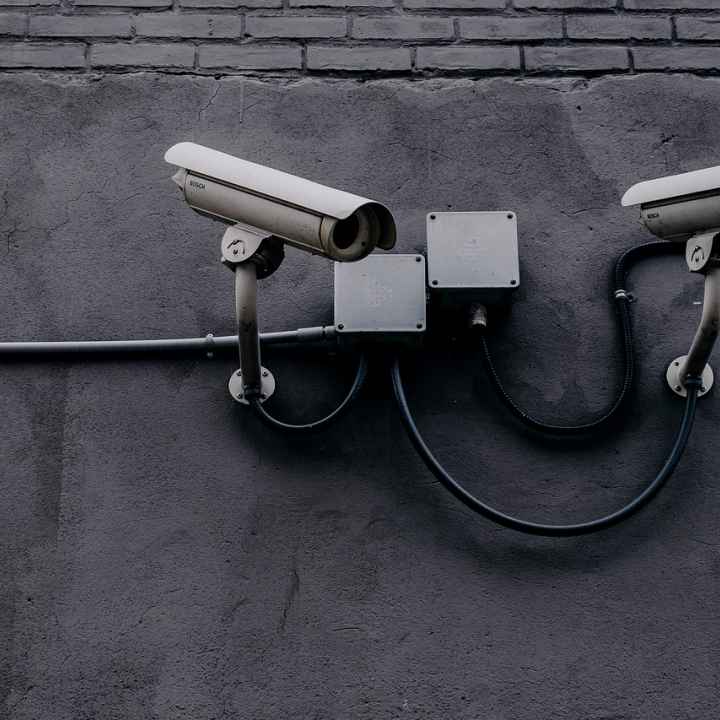 Photo of two security cameras.