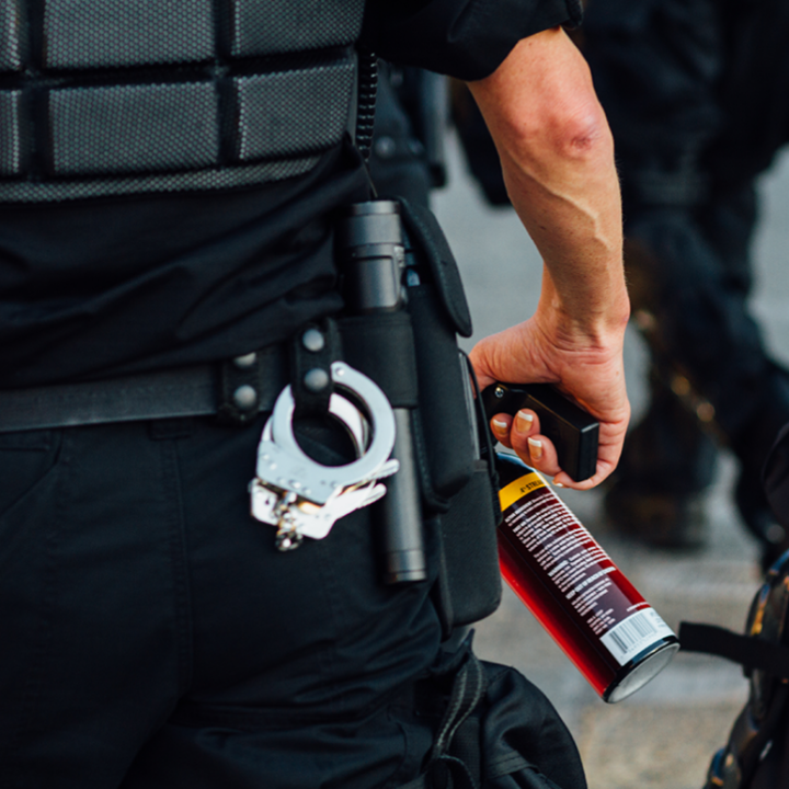 Photo of a canister of pepper spray on a police officer's belt.
