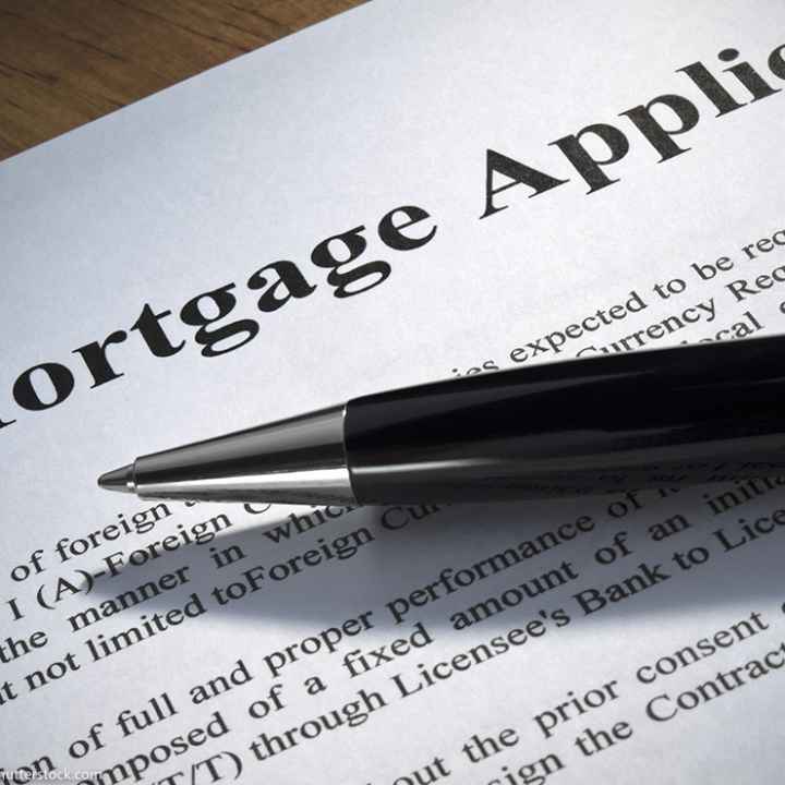 Close up of a mortgage application and a pen.