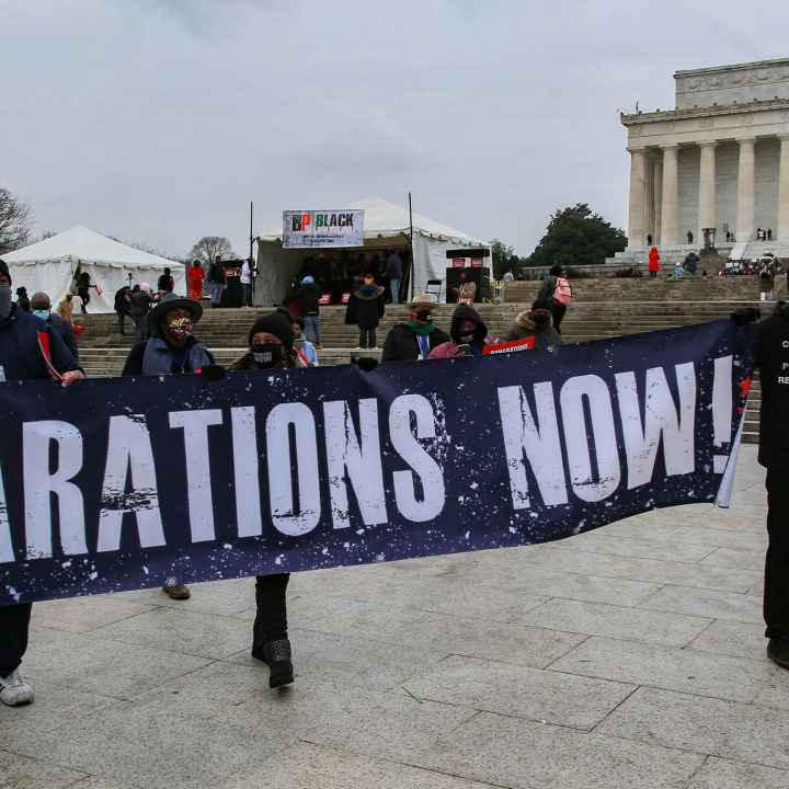 Demonstrators with the Reparationist Collective gather at the Lincoln Memorial in Washington, D.C. to demand reparations from slavery and inequity